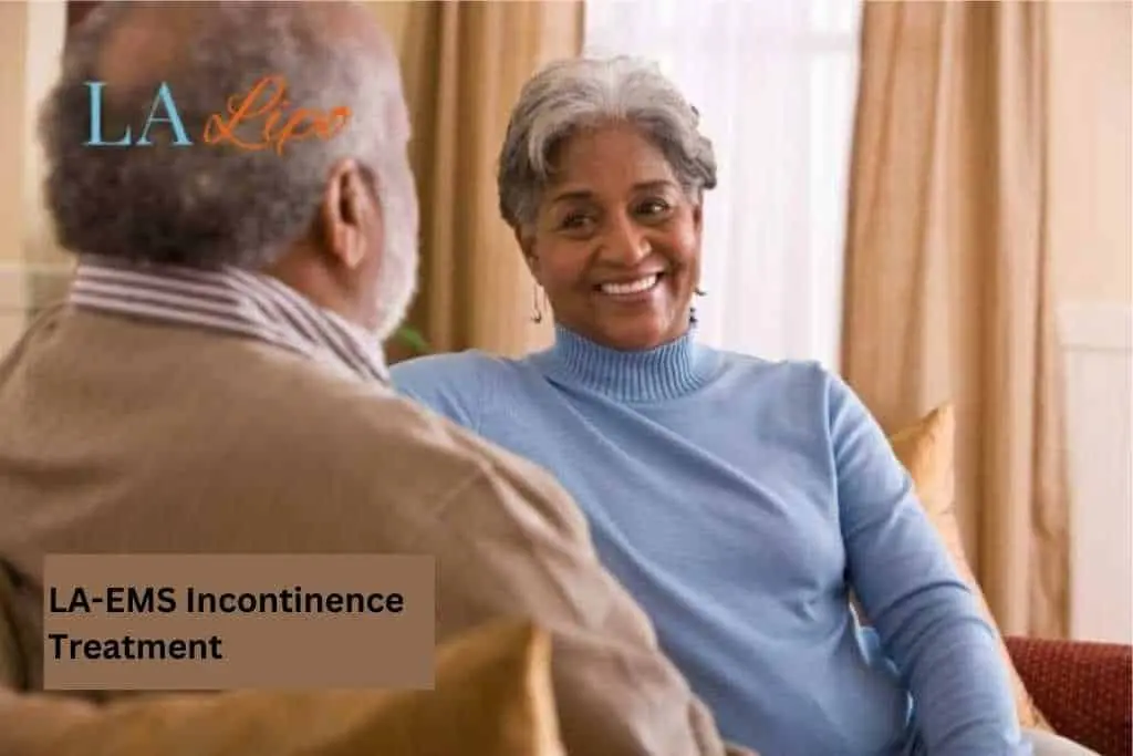 Couple sat smiling at each other - LA-EMS treatment Chesham