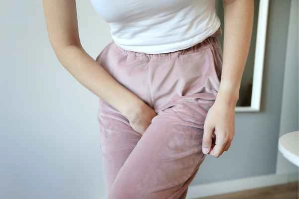 woman running for the toilet because of urinary incontinence Chesham